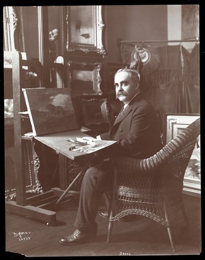 Drake in His Studio with a Painting of Lions in Progress, New York, 1907 by Byron Company